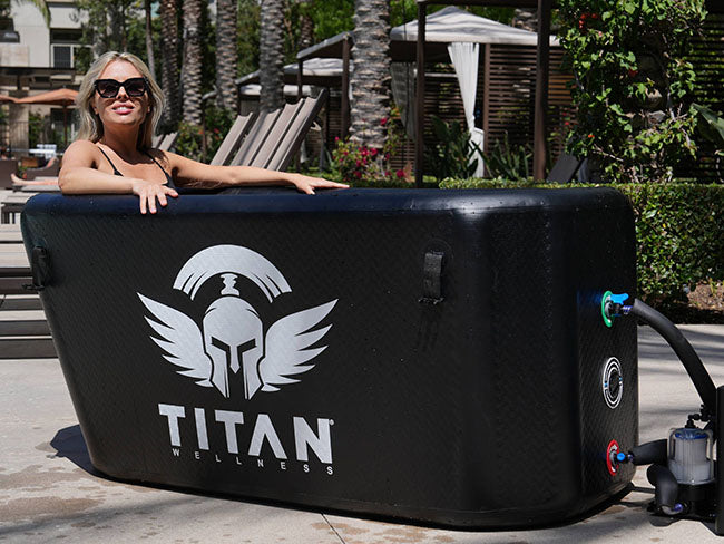 A person chilling in Titan Triumph Cold Plunge System Outside