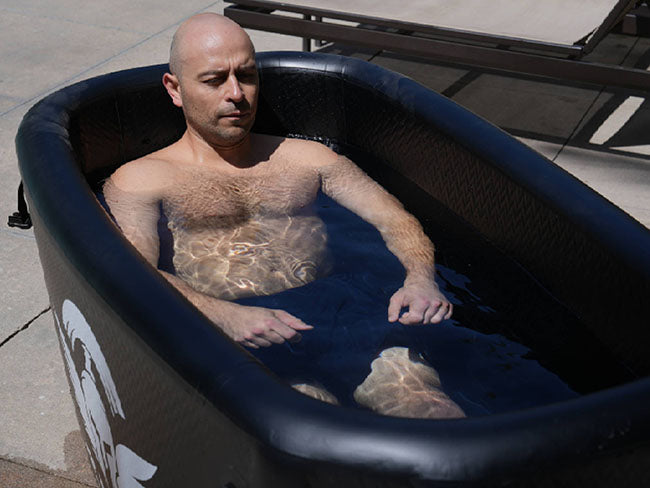 A person chilling in Titan Triumph Cold Plunge