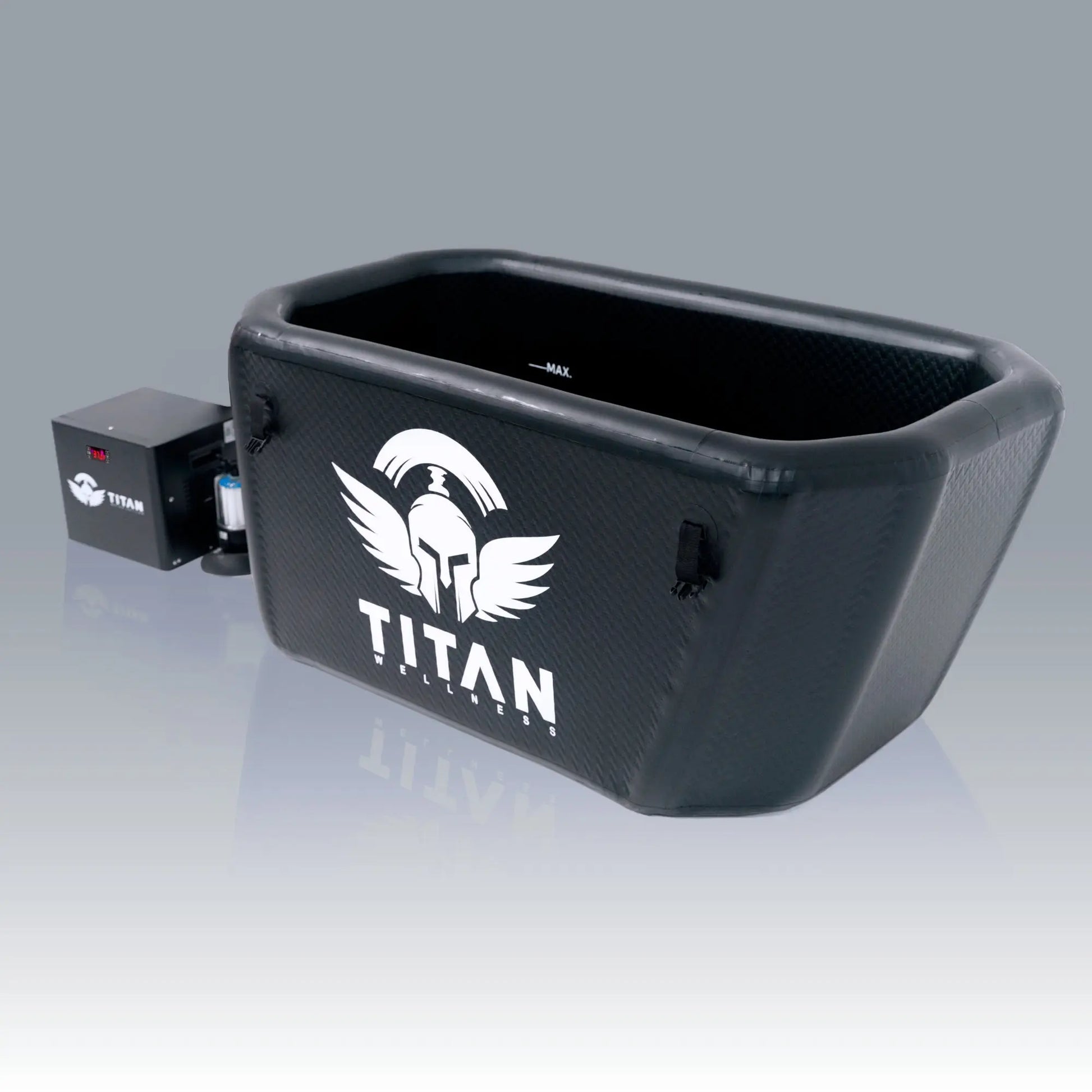 Triumph XL cold-plunge tub (black, angled-back) with lid closed and large TITAN logo, connected to a Titan chiller and inline filter on the left.