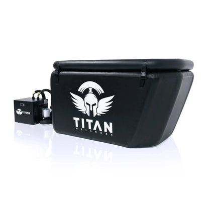 Triumph XL cold-plunge tub (black, angled-back) with lid closed and large TITAN logo, connected to a Titan chiller and inline filter on the left.