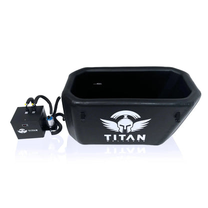  “Triumph XL cold plunge tub in black with the TITAN logo, shown from a top-down angle next to the Titan water chiller with hoses and in-line filter; interior ‘MAX’ fill line visible.”