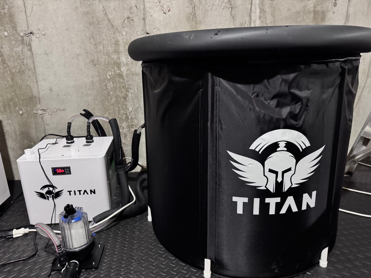 Customer review photo of Titan Bravo cold plunge with white Titan chiller, 58°F digital display, insulated hoses and 20 micron inline filter in an indoor setup